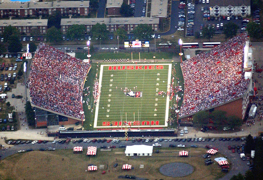 Huskies fans storming the Huskie Stadium field after a win